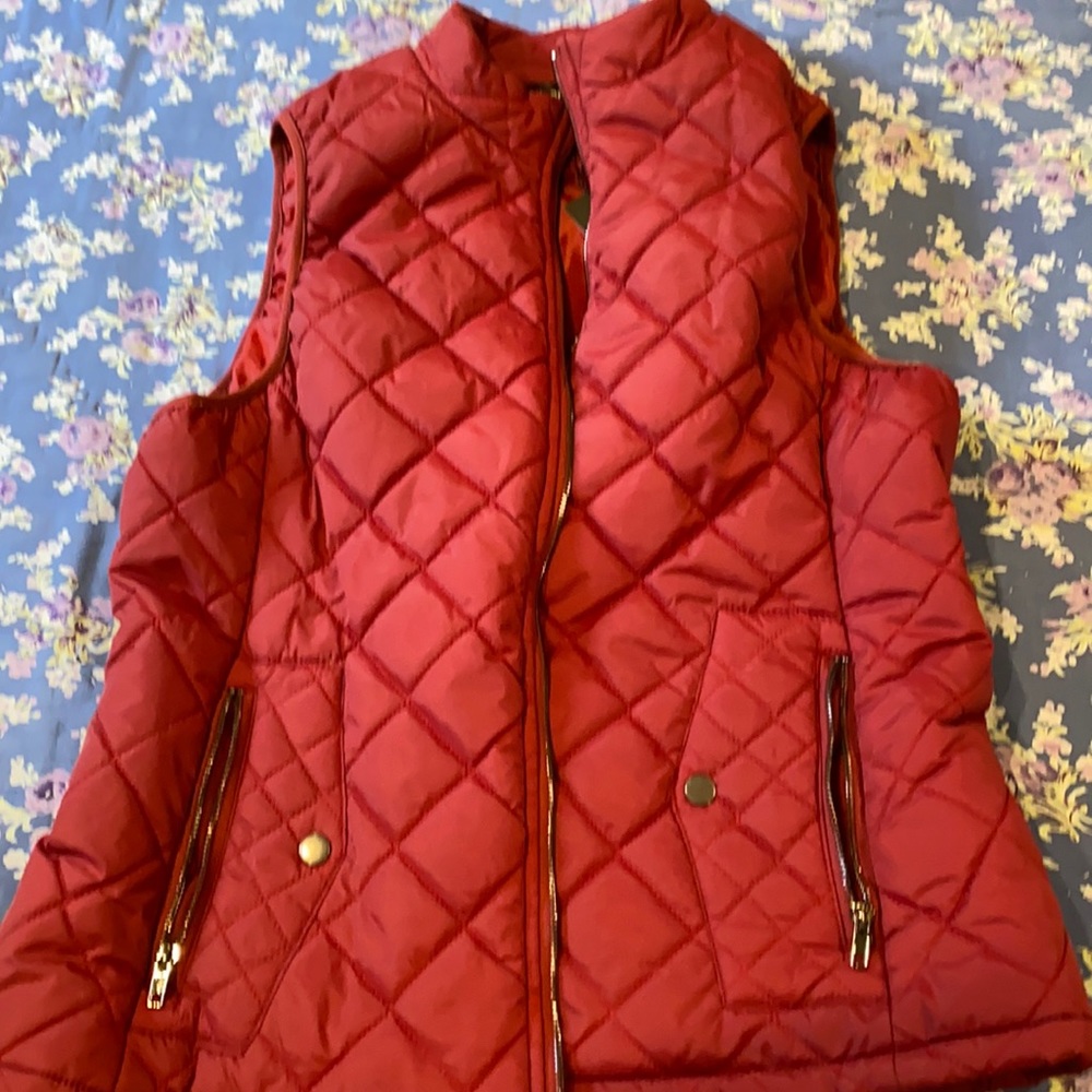 Maroon puffy vest, size large